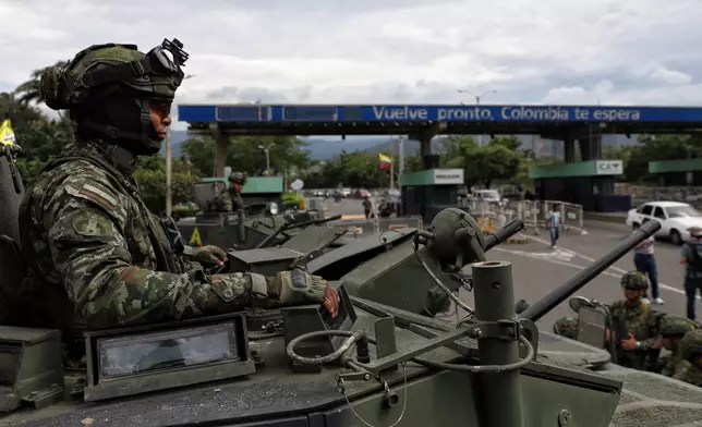 Colombian soldiers guard the border with Venezuela in Villa del Rosario, Colombia, Saturday, Jan. 3, 2026, after U.S. President Donald Trump announced that President Nicolás Maduro had been captured by U.S. forces. (AP Photo/Santiago Saldarriaga)