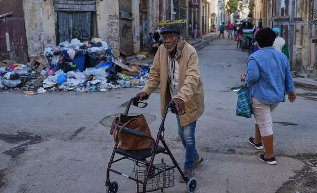 A man traverses a street in Old Havana, Monday, January 5, 2026. (AP Photo/Ramon Espinosa)
