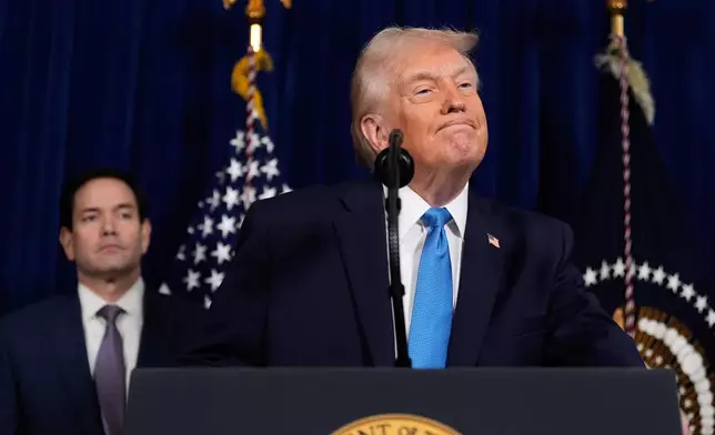 President Donald Trump listens to a question during a news conference at Mar-a-Lago, Saturday, Jan. 3, 2026, in Palm Beach, Fla., as Secretary of State Marco Rubio watches. (AP Photo/Alex Brandon)