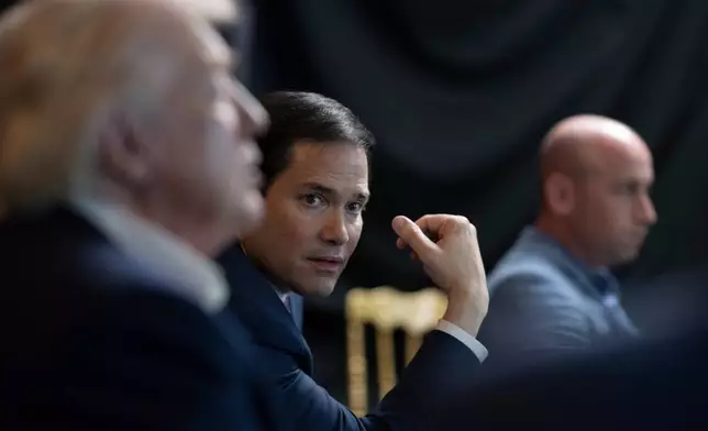 In this photo released by the White House, President Donald Trump monitors U.S. military operations in Venezuela, with Secretary of State Marco Rubio and White House deputy chief of staff Stephen Miller at Mar-a-Lago in Palm Beach, Fla., Saturday, Jan. 3, 2026. (Molly Riley/The White House via AP)