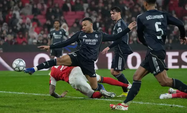 Real Madrid's Kylian Mbappe attempts a shoot at goal during a Champions League opening phase soccer match between Benfica and Real Madrid, in Lisbon, Wednesday, Jan. 28, 2026. (AP Photo/Armando Franca)