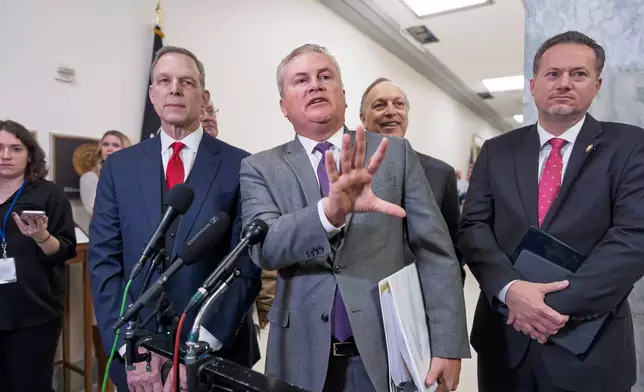 House Oversight Committee Chairman James Comer, R-Ky., center, joined from left by Rep. Scott Perry, R-Pa., Rep. Andy Biggs, R-Ariz., and Rep. Michael Cloud, R-Texas, speaks to reporters after former Secretary of State Hillary Clinton did not appear for a deposition as part of the panel's investigation into Jeffrey Epstein and those connected to him, at the Capitol in Washington, Wednesday, Jan. 14, 2026. (AP Photo/J. Scott Applewhite)