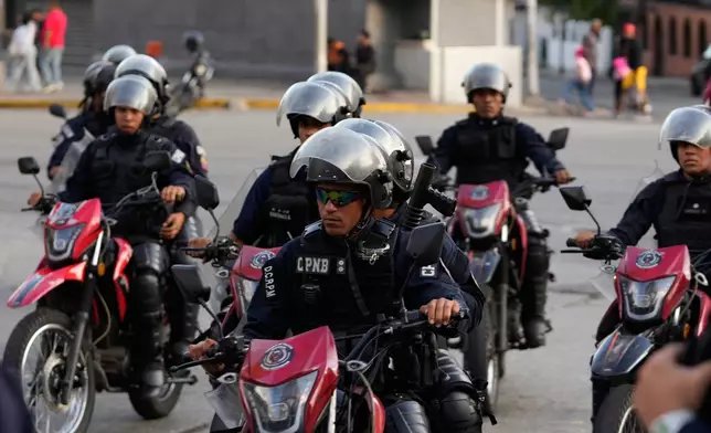 Police patrol near El Helicoide, headquarters of Venezuela's intelligence service and a detention center, in Caracas, Venezuela, Saturday, Jan. 10, 2026.(AP Photo/Matias Delacroix)