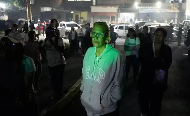 Mariana Gonzalez, the daughter of opposition leader Edmundo Gonzalez, whose husband is detained, waits outside the Rodeo I prison in Guatire, Venezuela, Thursday, Jan. 8, 2026, after National Assembly President Jorge Rodriguez said the government would release Venezuelan and foreign prisoners. (AP Photo/Matias Delacroix)