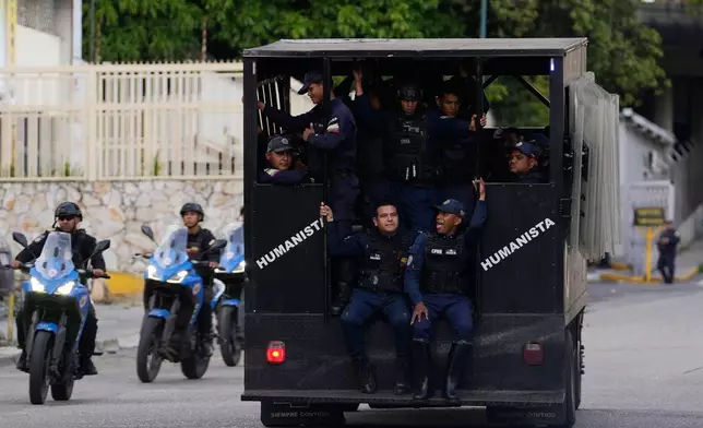 Police patrol near El Helicoide, headquarters of Venezuela's intelligence service and a detention center, in Caracas, Venezuela, Saturday, Jan. 10, 2026.(AP Photo/Matias Delacroix)
