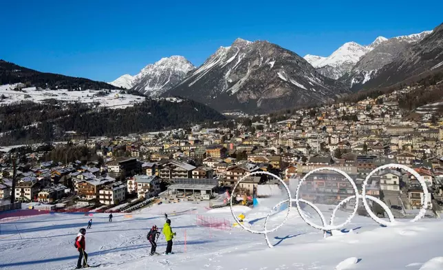 FILE - Olympic rings are displayed near a slope of the Stelvio Ski Center, venue for the alpine ski and ski mountaineering disciplines, at the 2026 Milan Cortina Winter Olympics, in Bormio, Italy, Jan. 16, 2025. (AP Photo/Luca Bruno, File)