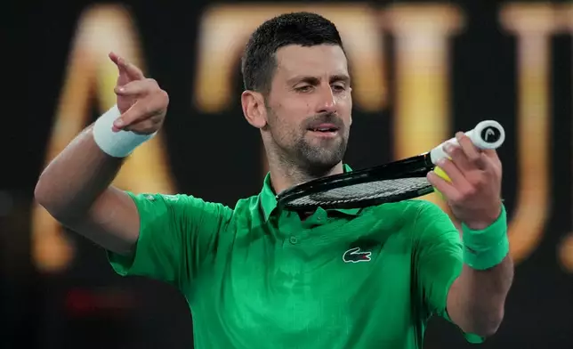 Novak Djokovic of Serbia reacts after defeating Botic van de Zandschulp of the Netherlands in their third round match at the Australian Open tennis championship in Melbourne, Australia, Saturday, Jan. 24, 2026. (AP Photo/Dita Alangkara)