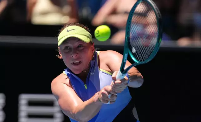 Amanda Anisimova of the U.S. plays a backhand return to compatriot Peyton Stearns during their third round match at the Australian Open tennis championship in Melbourne, Australia, Saturday, Jan. 24, 2026. (AP Photo/Aaron Favila)