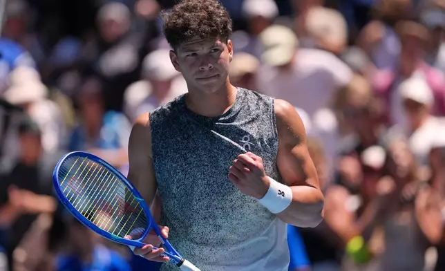 Ben Shelton of the U.S. reacts after defeating Dane Sweeny of Australia during their second round match at the Australian Open tennis championship in Melbourne, Australia, Thursday, Jan. 22, 2026. (AP Photo/Asanka Brendon Ratnayake)