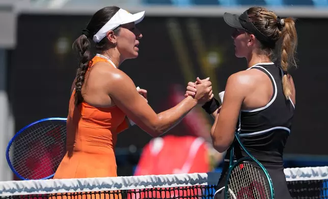 Jessica Pegula, left, of the U.S. is congratulated by Oksana Selekhmeteva of Russia following their third round match at the Australian Open tennis championship in Melbourne, Australia, Saturday, Jan. 24, 2026. (AP Photo/Aaron Favila)