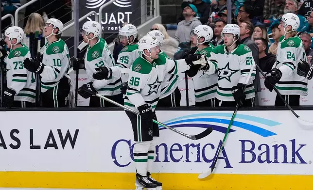 Dallas Stars right wing Mikko Rantanen (96) celebrates with teammates after scoring a goal during the third period of an NHL hockey game against the San Jose Sharks, Saturday, Jan. 10, 2026, in San Jose, Calif. (AP Photo/Godofredo A. Vásquez)