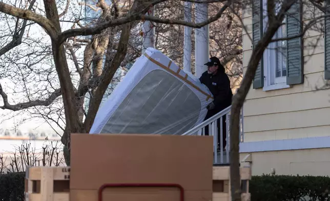 Movers carry a mattress to Gracie Mansion, Monday, Jan. 12, 2026, in New York. (AP Photo/Yuki Iwamura)