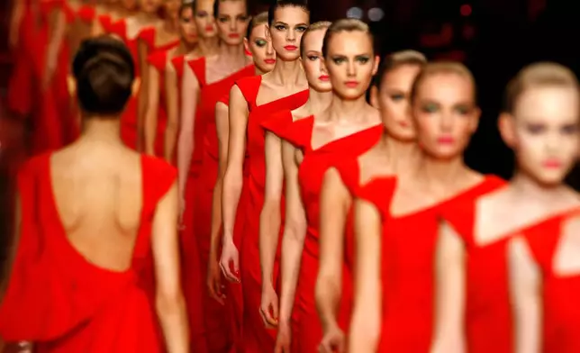 FILE - Models take to the runway after the presentation of Italian fashion designer Valentino's Haute Couture Spring-Summer 2008 collection, in Paris, Jan. 23, 2008. (AP Photo/Jacques Brinon, File)