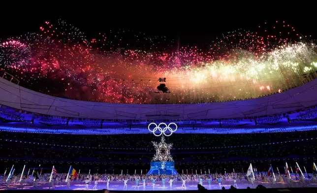 FILE - Fireworks explode during the closing ceremony of the 2022 Winter Olympics, Feb. 20, 2022, in Beijing. (AP Photo/Bernat Armangue, File)