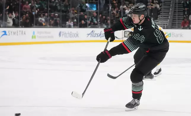 Seattle Kraken right wing Kaapo Kakko scores an empty net goal against the Boston Bruins during the third period of an NHL hockey game Tuesday, Jan. 6, 2026, in Seattle. (AP Photo/Lindsey Wasson)