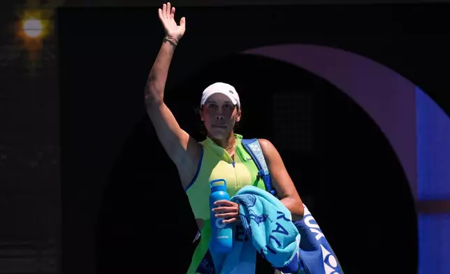 Madison Keys of the U.S. waves at the crowd following her loss to her compatriot Jessica Pegula in their fourth round match at the Australian Open tennis championship in Melbourne, Australia, Monday, Jan. 26, 2026. (AP Photo/Mark Baker)