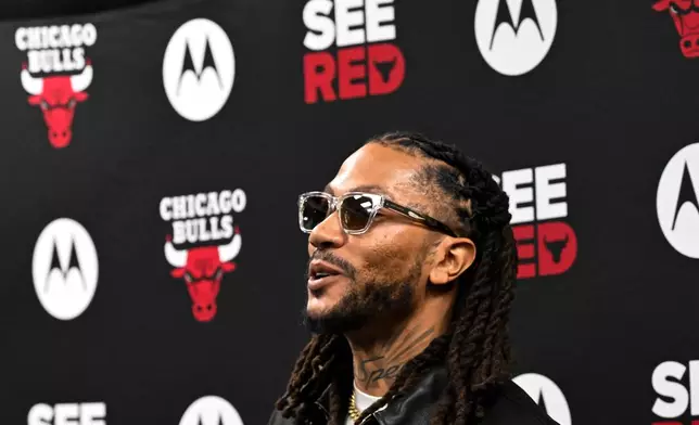 Former Chicago Bulls player Derrick Rose, smiles after a press conference before an NBA basketball game against the Boston Celtics, Saturday, Jan. 24, 2026, in Chicago. (AP Photo/Matt Marton)