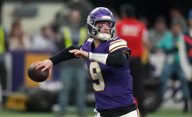 Minnesota Vikings quarterback J.J. McCarthy throws a pass during the first half of an NFL football game against the Green Bay Packers, Sunday, Jan. 4, 2026, in Minneapolis. (AP Photo/Ross D. Franklin)