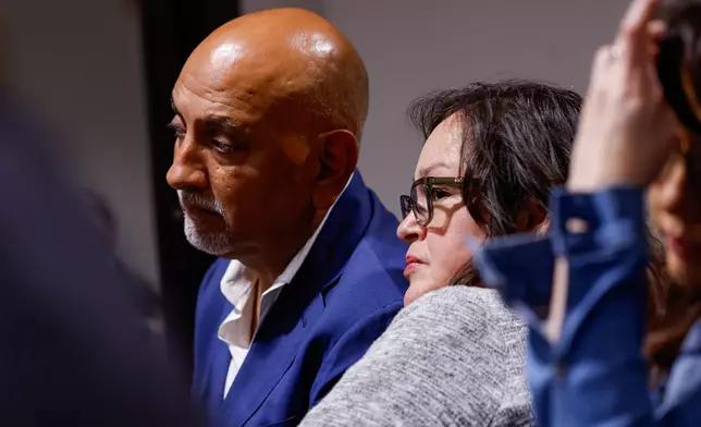 Jesse Rizo and his wife Juanita Cazares-Rizo listen to the prosecution and defense deliver their closing statements to the jury on the 11th day of the trial for former Uvalde school district police officer Adrian Gonzales at the Nueces County Courthouse on Wednesday, Jan. 21, 2026, in Corpus Christi, Texas. T (Sam Owens /The San Antonio Express-News via AP, Pool)