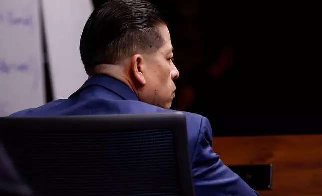 Former Uvalde school district police officer Adrian Gonzales listens to closing statements on the 11th day of his trial at the Nueces County Courthouse on Wednesday, Jan. 21, 2026, in Corpus Christi, Texas. (Sam Owens /The San Antonio Express-News via AP, Pool)