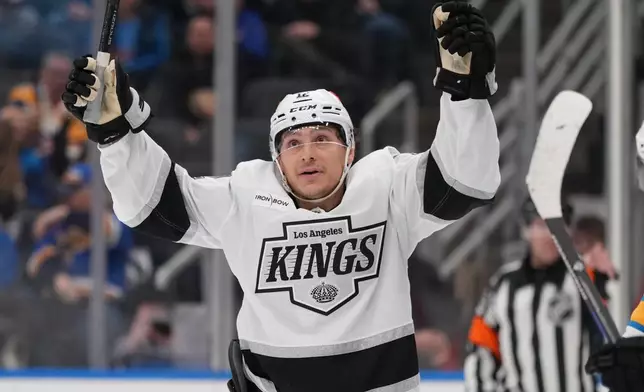 Los Angeles Kings' Trevor Moore (12) celebrates after scoring during the third period of an NHL hockey game against the St. Louis Blues Saturday, Jan. 24, 2026, in St. Louis. (AP Photo/Jeff Roberson)