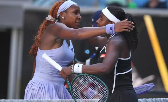 Coco Gauff, left, of the U.S. is congratulated by compatriot Hailey Baptiste following their third round match at the Australian Open tennis championship in Melbourne, Australia, Friday, Jan. 23, 2026. (AP Photo/Dita Alangkara)