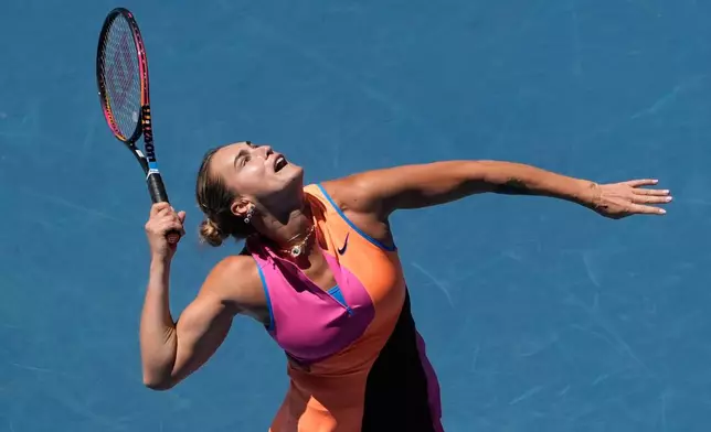 Aryna Sabalenka of Belarus serves to Anastasia Potapova of Austria during their third round match at the Australian Open tennis championship in Melbourne, Australia, Friday, Jan. 23, 2026. (AP Photo/Asanka Brendon Ratnayake)