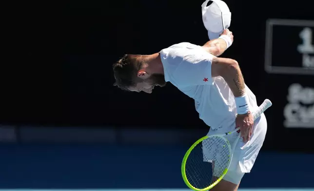 Corentin Moutet of France bows during his third round match against Carlos Alcaraz of Spain at the Australian Open tennis championship in Melbourne, Australia, Friday, Jan. 23, 2026. (AP Photo/Asanka Brendon Ratnayake)
