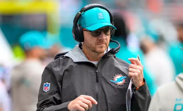 FILE - Miami Dolphins quarterbacks/pass game coordinator Darrell Bevell walks on the sidelines during an NFL football game against the New Orleans Saints, Nov. 30, 2025, in Miami Gardens, Fla. (AP Photo/Doug Murray, File)