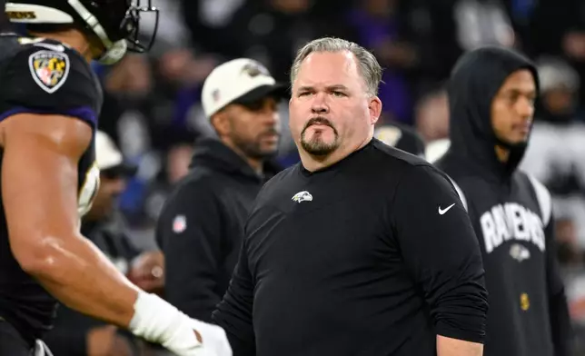 FILE - Baltimore Ravens offensive coordinator Greg Roman looks on during pre-game warm-ups before an NFL football game against the Pittsburgh Steelers, Jan. 1, 2023, in Baltimore. (AP Photo/Terrance Williams, File)