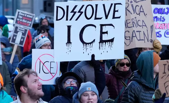 People protest against U.S. Immigrations and Customs enforcement in Portland, Maine, Friday, Jan. 30, 2026. (AP Photo/Robert F. Bukaty)