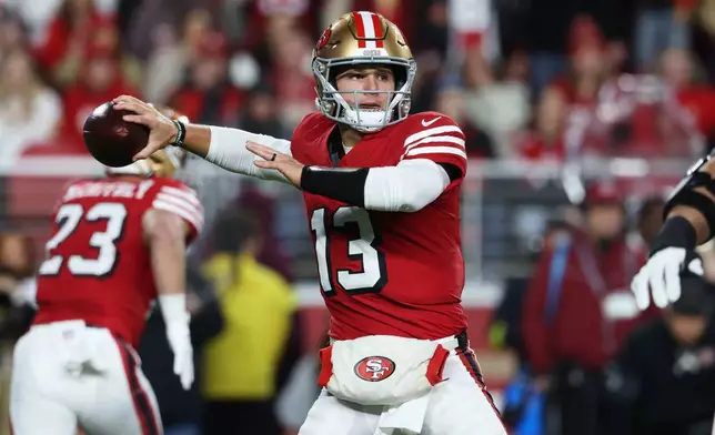 San Francisco 49ers quarterback Brock Purdy (13) passes against the Chicago Bears during the first half of an NFL football game in Santa Clara, Calif., Sunday, Dec. 28, 2025. (AP Photo/Jed Jacobsohn)