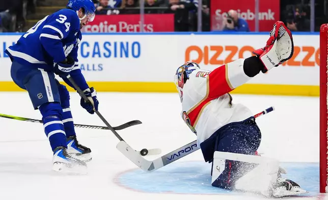 Toronto Maple Leafs' Auston Matthews (34) is stopped by Florida Panthers goaltender Sergei Bobrovsky (72) during the second period of an NHL hockey game in Toronto, Tuesday, Jan. 6, 2026. (Frank Gunn/The Canadian Press via AP)