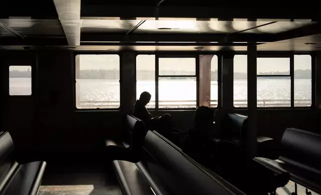 A person takes the Staten Island Ferry, Tuesday, Jan. 27, 2026, in New York. (AP Photo/Yuki Iwamura)