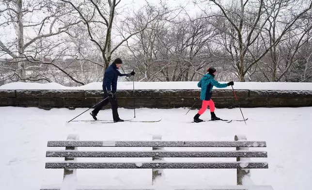 Melissa Welsh and Kevin Daly ski in Riverside Park in New York, Monday, Jan. 26, 2026. (AP Photo/Seth Wenig)