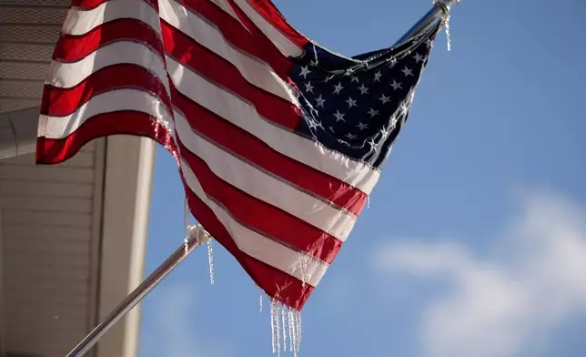 Icicles cling to an American flag in Nashville, Tenn., (AP Photo/George Walker IV)