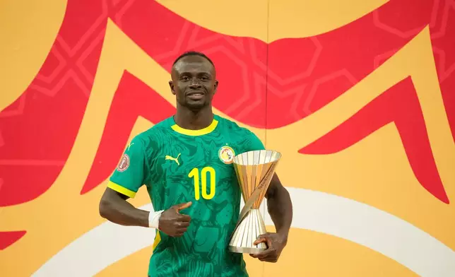 Senegal's Sadio Mane holds tropy for the best player of the torunament after the Africa Cup of Nations final soccer match between Senegal and Morocco, in Rabat, Morocco, Sunday, Jan. 18, 2026. (AP Photo/Mosa'ab Elshamy)