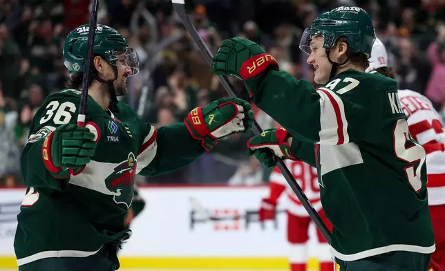 Minnesota Wild right wing Mats Zuccarello, left, celebrates his goal with left wing Kirill Kaprizov during the third period of an NHL hockey game against the Detroit Red Wings Thursday, Jan. 22, 2026, in St. Paul, Minn. (AP Photo/Matt Krohn)