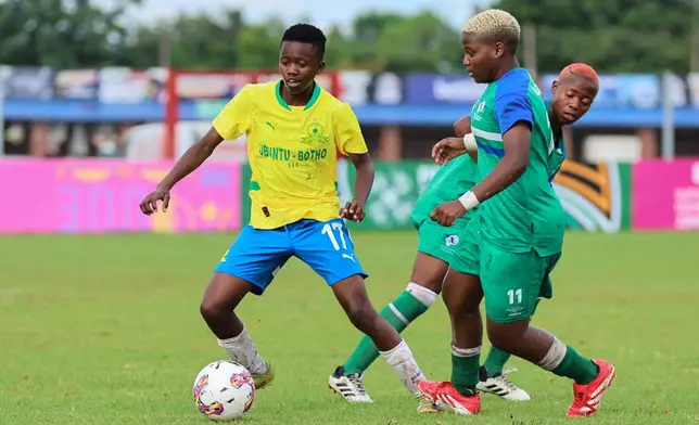 Girls participate in an U-17 tournament promoted by Africa's governing body to promote cervical cancer vaccination in Norton, Zimbabwe, Thursday, Dec. 18, 2025. (AP Photo/Aaron Ufumeli)