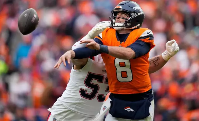 New England Patriots linebacker Christian Elliss (53) sacks Denver Broncos quarterback Jarrett Stidham (8) during the first half of the AFC Championship NFL football game, Sunday, Jan. 25, 2026, in Denver. (AP Photo/Ashley Landis)