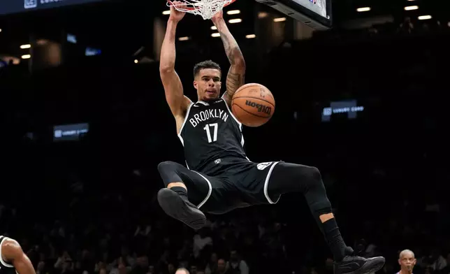 Brooklyn Nets forward Michael Porter Jr. dunks during the first half of an NBA basketball game against the Denver Nuggets, Sunday, Jan. 4, 2026, in New York. (AP Photo/Yuki Iwamura)