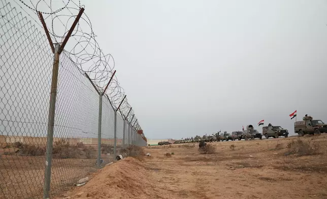 Iraqi Border Guards patrol in armored vehicles along the border with Syria, in Sinjar, northern Iraq, Thursday, Jan. 22, 2026. (AP Photo/Farid Abdulwahed)