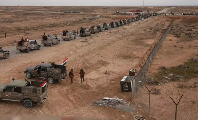 Iraqi Border Guards deploy along the Syrian border amid heightened security following recent fighting in Syria, in Sinjar, northern Iraq, Thursday, Jan. 22, 2026. (AP Photo/Farid Abdulwahed)