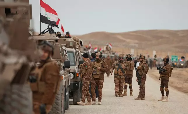 Iraqi Border Guards patrol along the border with Syria, in Sinjar, northern Iraq, Thursday, Jan. 22, 2026. (AP Photo/Farid Abdulwahed)
