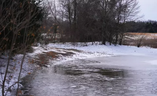 A pond where neighbors say three young boys died after falling into the water is seen Tuesday, Jan. 27, 2026, in Bonham, Texas. (AP Photo/Julio Cortez)