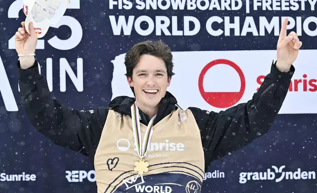 FILE - Gold medalist Scotty James of Australia reacts on the podium after the Men's Snowboard Halfpipe competition at the FIS Snowboard, Freestyle and Freeski World Championships in St. Moritz, Switzerland, Saturday, March 29, 2025. (Gian Ehrenzeller/Keystone via AP, File)