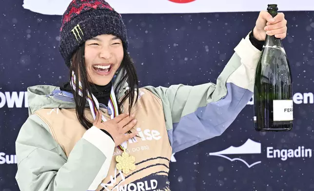 FILE - Gold medalist Chloe Kim of USA reacts on the podium after the Women's Snowboard Halfpipe competition at the FIS Snowboard, Freestyle and Freeski World Championships in St. Moritz, Switzerland, Saturday, March 29, 2025. (Gian Ehrenzeller/Keystone via AP, File)