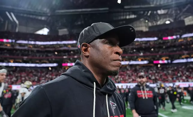 Atlanta Falcons head coach Raheem Morris walks off the field after an NFL football game against the New Orleans Saints, Sunday, Jan. 4, 2026, in Atlanta. (AP Photo/Brynn Anderson)