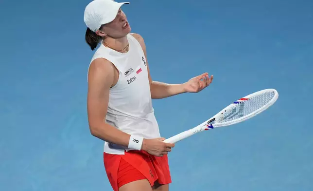 Iga Swiatek of Poland reacts after missing a shot to Coco Gauff of the U.S. in their semifinal match at the United Cup tennis tournament in Sydney, Saturday, Jan. 10, 2026. (AP Photo/Rick Rycroft)