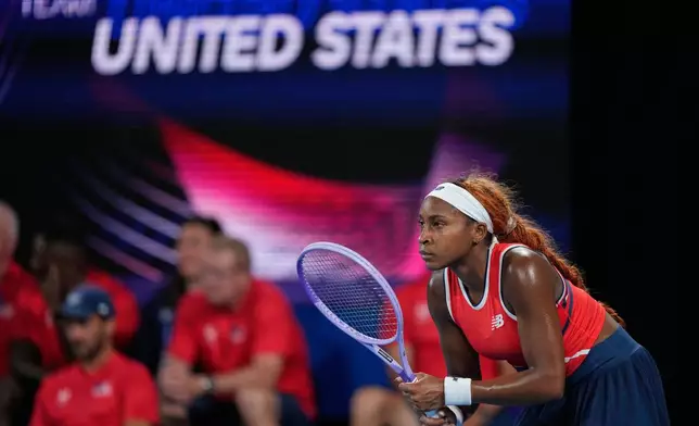 Coco Gauff of the U.S. waits to return serve from Iga Swiatek of Poland during their semifinal match at the United Cup tennis tournament in Sydney, Saturday, Jan. 10, 2026. (AP Photo/Rick Rycroft)